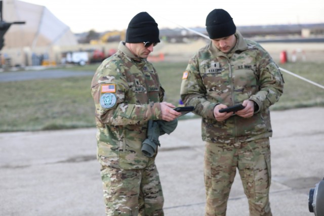 MIHAIL KOGALNICEANU, Romania – Lt. Col. Jesse Blanton, Commander, 5th Battalion, 101st Aviation Regiment, and 1st Lt. Adam Kanavos, UH-60 Pilot, Bravo Co., 5th Battalion, 101st Aviation Regiment review mission data after returning to base from...