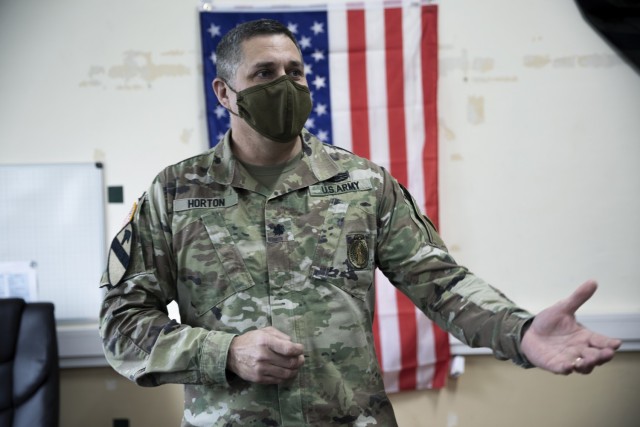 Lt. Col. Darren Horton, leader of the Training Center Advisory Team, addresses members of his operations group during a promotion ceremony at Combat Training Center-Yavoriv, Ukraine Jan. 4.