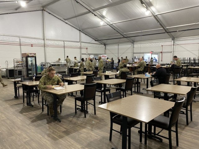 The temporary dining facility consists of a tent and three trailers which house all equipment required to prepare and serve meals. The only notable change of service at the temporary dining facility is the exclusion of an omelet bar, which did not...
