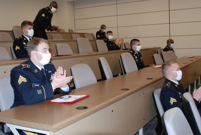U.S. Army Prime Power School students applaud their peers during the virtual graduation ceremony held at the Digital Training Center, Fort Leonard Wood, Mo., Dec. 15, 2020. During the ceremony, 13 Prime Power School students received certificates...