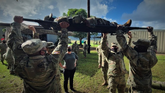 Multi-component Soldiers from 311th Signal Command (Theater) attempt to transport a simulated litter patient during the command's Battle Assembly, Jan. 23-24, 2021 at Schofield Barracks on Oahu, Hawaii. The event was conducted to train Soldiers on...