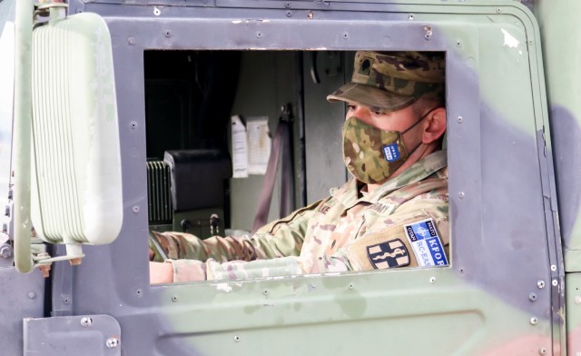 U.S. Army Spc. Tevin Walker, an evacuation medic for Regional Command-East, Kosovo Force 28, stages a field ambulance during a joint force protection exercise in Kosovo on Jan. 23, 2021. A mock vehicle-born improvised explosive device was detected...