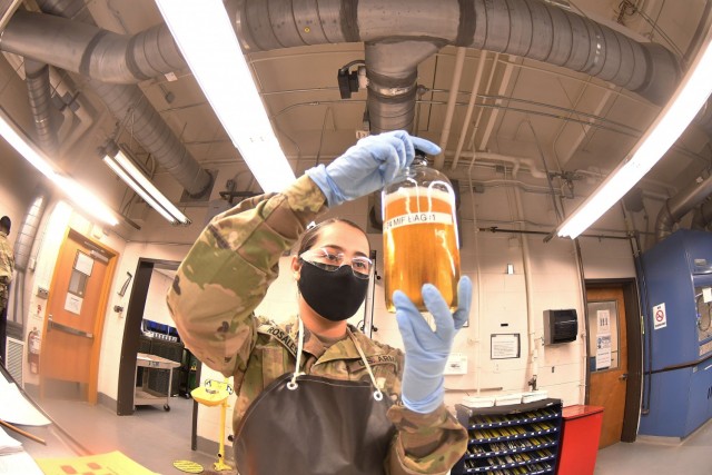 Army Pvt. Janeth Rosales conducts a visual inspection of fuel for debris and color during a 92L Petroleum Laboratory Specialist Course training session Jan. 22.