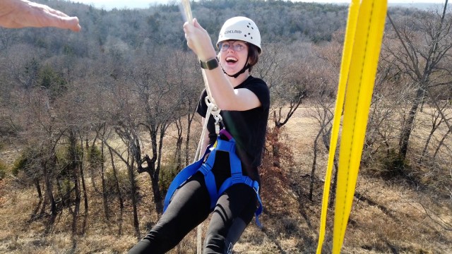 Pfc. Beverly Jenkins, 3rd Battalion, 13th Field Artillery, lowers herself Jan. 22 rappelling to the ground in Sulphur, Oklahoma. She was part of a group of 75th Field Artillery Brigade Soldiers who went to the Chickasaw Retreat and Conference...