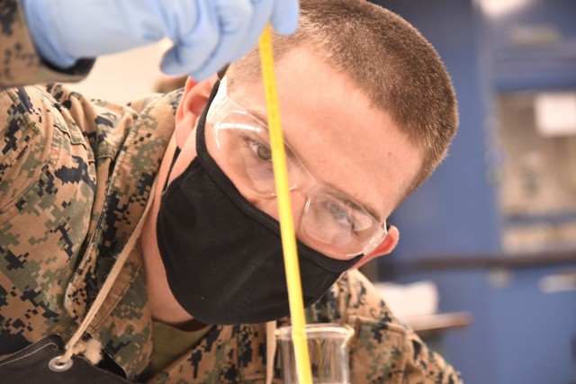 Marine Corps Lance Cpl. Kirkland D. Cochran observes fuel temperature while conducting American Petroleum Institute testing Jan. 22 at the Lab Training Division, Quartermaster School.