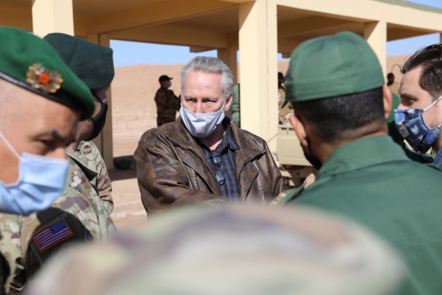 Scott McWhorter, center, coordinates logistics Jan. 20, 2021, for U.S. and Moroccan forces participating in African Lion 21. McWhorter, a Department of Army civilian, has dozens of exercises and training activities in Africa as part of the Southern European Task Force, Africa, G7 Exercises team. McWhorter joined two dozen U.S. military planners in Morocco to establish plans for the African Lion 21 exercise, scheduled for June. African Lion, U.S. Africa Command's largest exercise, has increased interoperability among U.S. partners and Allies since 2003. Plans for AL21 involve more than 10,000 troops from the United States, Morocco, Tunisia, Senegal and elsewhere. The global COVID-19 pandemic curtailed the previous year's exercise. Plans for AL21 include COVID-19 mitigations and flexible options to ensure maximum participation and value for participating countries. (U.S. Army photo by Maj. Cain S. Claxton/Southern European Task Force, Africa)