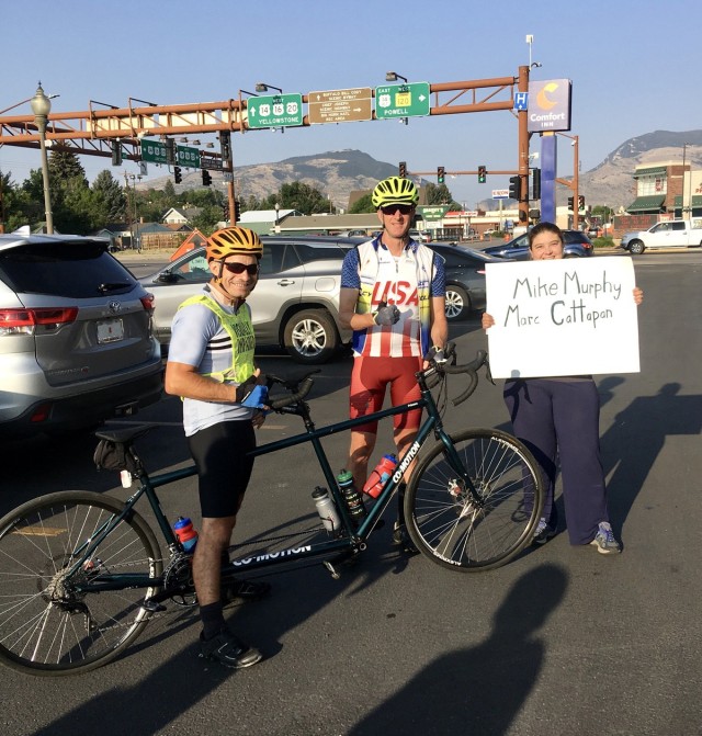Staff Sgt. Mike Murphy (left) and Marc Cattapan (center) show off their tandem bike they used to ride in the Beartooth Challenge. (Photo via Marc Cattapan)