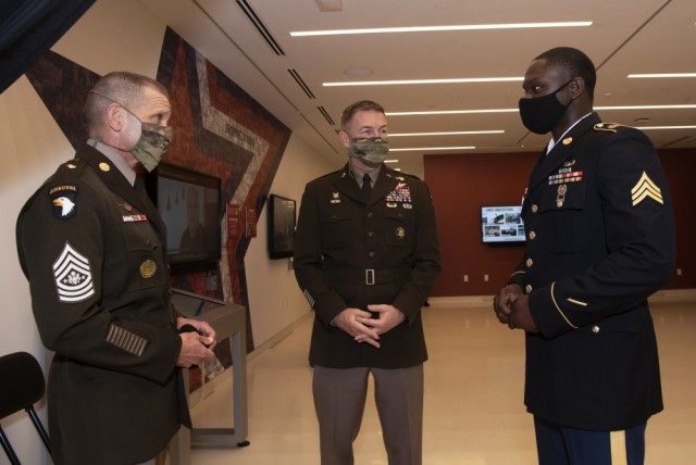 Sgt. Maj. of the Army Michael A. Grinston, left, and Army Chief of Staff Gen. James C. McConville talk to the 2020 Soldier of the Year, Sgt. James Akinola, at the opening of the National Museum of the U.S. Army at Fort Belvoir, Va., Nov. 11, 2020.