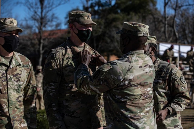 U.S. Army Spc. Anchor Jennison of the 4th Infantry Division, is awarded the Meritorious Service Medal for finishing in 1st place during the 2021 Command Sgt. Maj. Jack L. Clark, Jr. U.S. Army Best Medic Competition (ABMC) on Fort Gordon, Ga., Jan....