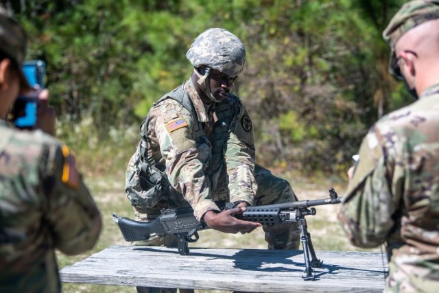 Sgt. James Akinola completes the weapons station during the warrior tasks and battle drills portion of the U.S. Army Best Warrior Competition, Oct. 1, 2020. 