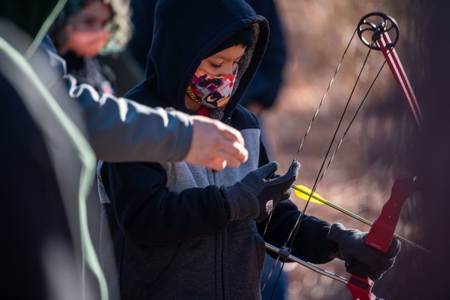 William Sexton, 10, learns how to pull back the bowstring during Beginners’ Archery, Jan 23.