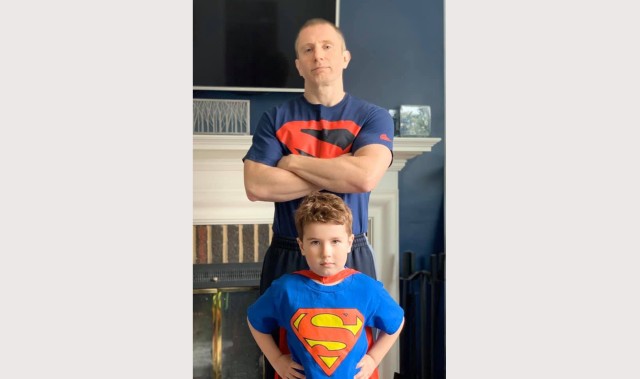 Sgt. 1st Class Phillip Kennedy Johnson, pictured with his son, Anders, at his Baltimore-area home, is the new author of DC Comics&#39; Superman and Action Comics. His Superman story arc begins in March 2021. 