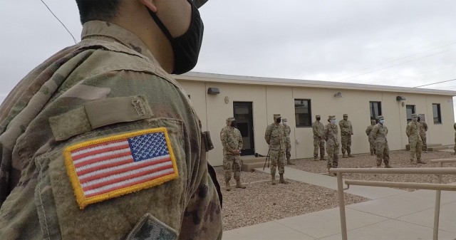 Soldiers stand in a socially-distanced formation during the opening of the 2021 tax center at Fort Bliss, Texas, Jan. 20, 2021. (Digital image extracted from video footage)