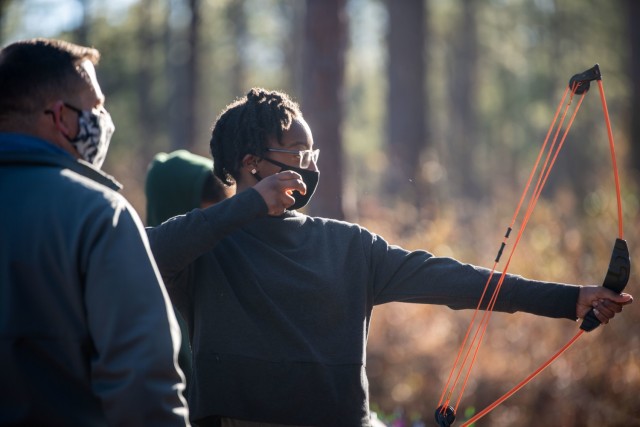 Kaziyah Boone-Spruill, 13, shoots at a target during Beginners’ Archery, Jan 23.