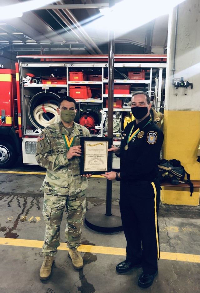WIESBADEN, Germany Lt. Col. Edwin Escobar (left), provost marshal and director of emergency services at USAG Wiesbaden, awards Chief of Police Jason R. Kesselring the Order of the Marechaussee Award on Jan. 21, 2021.