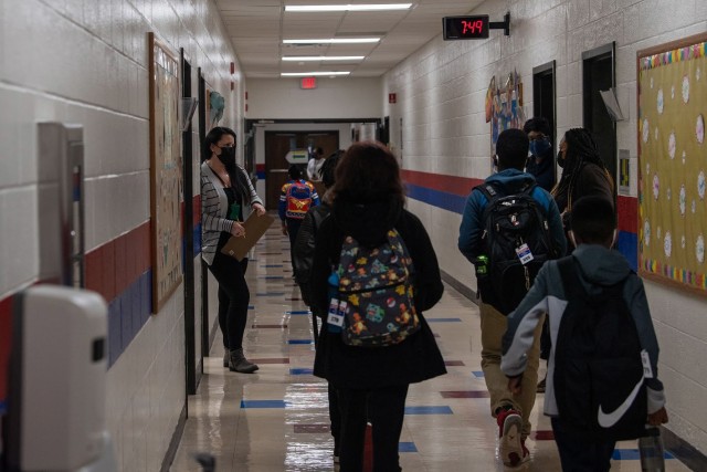 Third grade teacher Jennifer McMichael watches as students file down the hallways at C.C. Pinckney Elementary School Jan. 25. Fort Jackson schools resumed in-person teaching for the first time since March 2020.