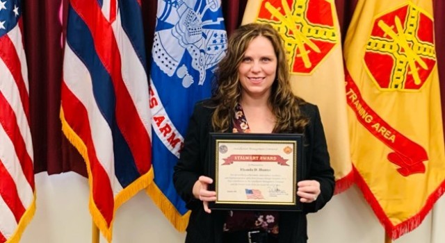 Rhonda Hunter receives the Installation Management Command Stalwart Award Jan. 28.