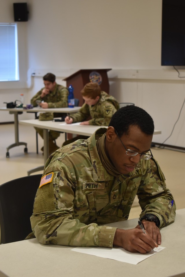 CHIÈVRES, Belgium – Spc. Arnando Smith, a mid-shift patrol for DES at Chièvres Air Base, whose hometown is Atlanta, takes a written portion of the U.S. Army Garrison Benelux Best Warrior Competition. After a week competing against their...