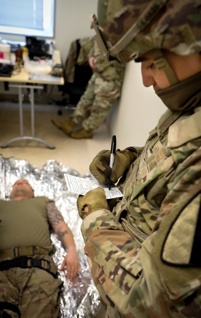 A Trooper assigned to 2nd Battalion, 8th Cavalry Regiment, fills out a casualty card during Tactical Combat Casualty Care assessments Jan. 30, 2021, at the Pabrade Training Area, Lithuania. The assessment will help identify strengths and...