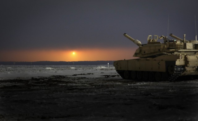 An illumination round fired by 2nd Battalion, 8th Cavalry Regiment’s mortar section bathes a large area of a range in support of a section gunnery on Jan. 22, 2021, at the Pabrade Training Area, Lithuania. The gunnery tested the skills of Abrams...