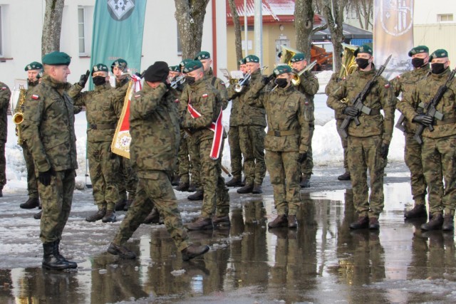 Special guest General Jaroslaw Mika, head of Polish Armed Forces, salutes his Troops during the NATO enhanced Forward Presence Battle Group Poland Change of Command Ceremony Jan.28, 2021, at Bemowo Piskie Training Area, Poland.(Photo courtesy of eFP BGP PAO)