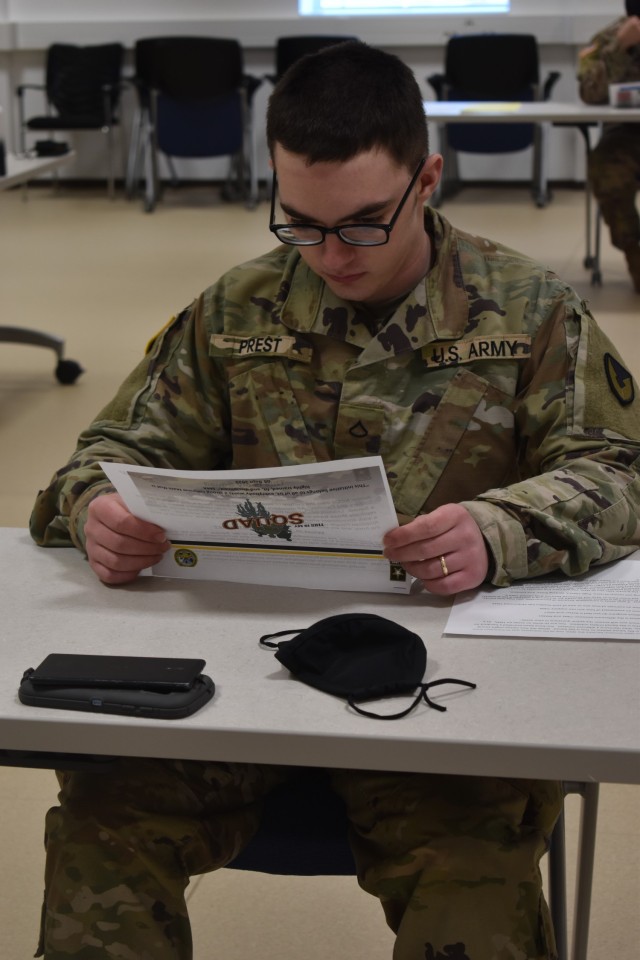 CHIÈVRES, Belgium -- Pfc. Joseph Prest, the religious affairs specialist at JFC Brunssum, the Netherlands, whose hometown is Carbondale, Illinois, prepares for a written portion of the U.S. Army Garrison Benelux Best Warrior Competition. After a...