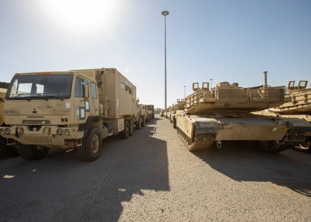 Humvees, M2 Bradley Fighting Vehicles and other vehicles are staged for transfer at the Port of Shuaiba for the upcoming Iron Union exercise Jan. 21, 2020 at the Port of Shuaiba, Kuwait. The equipment and rolling stock will go through the same process in the United Arab Emirates once the Iron Union 14 exercise has concluded. The 1185th DDSB will coordinate with adjacent units in the UAE to receive the stock back at the Port of Shuaiba. (U.S. Army photo by Spc. Zoran Raduka, 1st TSC Public Affairs)