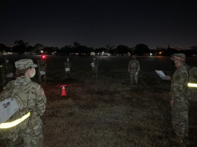 Brooke Army Medical Center Psychology and Social Work interns and residents participate in a pre-dawn 2 mile memorial road march on Joint Base San Antonio-Fort Sam Houston Nov. 20, 2020. The Soldiers partnered with their counterparts from Desmond T. Doss Health Clinic, Schofield Barracks, Hawaii, to honor 13 Soldiers who were killed in action during wartime operations. (courtesy photo)