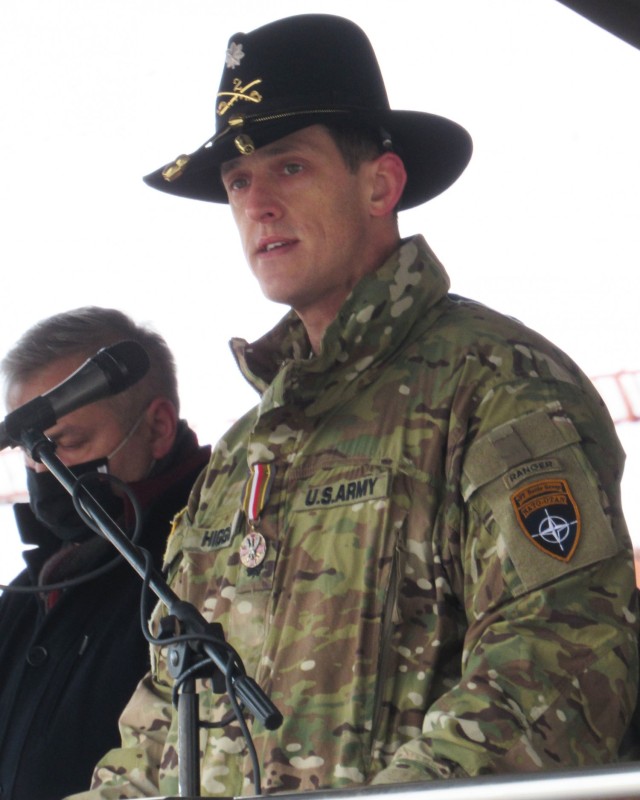 United States Army LTC Jeffery Higgins, 2d Squadron, 2d Cavalry Regiment, speaks to the Troops for the last time as Battle Group Commander wearing the medal presented to him by General Jaroslav Mika Head of the Polish Armed Forces, during the enhanced Forward Presence Battle Group Poland Change of Command Ceremony Jan.28, 2021, at Bemowo Piskie Training Area, Poland. (Photo courtesy of eFP BGP PAO)