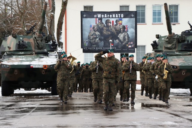 Polish ArmyTroops from the 15th Mechanized Brigade, 16th Division, march onto the parade field during NATO enhanced Forward Presence Battle Group Poland Change of Command Ceremony Jan.28, 2021, at Bemowo Piskie Training Area, Poland. (Photo courtesy of eFP BGP PAO)