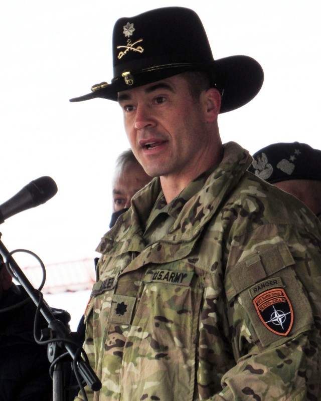 U.S. Army Lt. Colonel Jason Adler, 1st Squadron, 2d Cavalry Regiment, speaks to the Troops in his new command at NATO enhanced Forward Presence Battle Group Poland during a Change of Command Ceremony Jan. 28, 2021, at Bemowo Piskie Training Area, Poland.