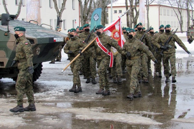 Polish Army Troops from the 15th Mechanized Brigade, 16th Division, march onto the parade field during NATO enhanced Forward Presence Battle Group Poland Change of Command Ceremony Jan.28, 2021, at Bemowo Piskie Training Area, Poland. (Photo courtesy of eFP BGP PAO)