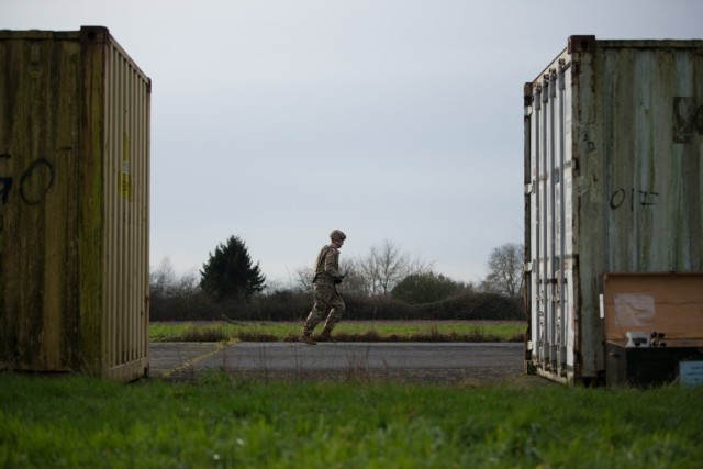 U.S. Army Spc. Hunter Tinsley, a U.S. Army Garrison Benelux MP assigned in Duelmen, Germany, runs under indirect fire for the medical lane of the Best Warrior Competition, on Chièvres Air Base, Belgium, Jan. 26, 2021. (U.S. Army photo by...