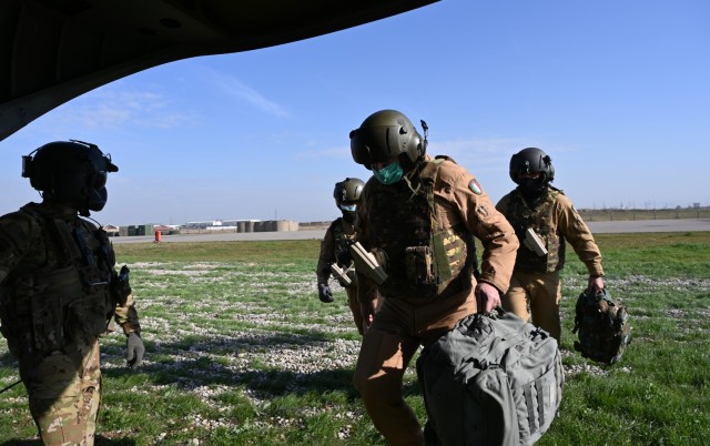 U.S. Soldiers with Task Force Gambler and Italian soldiers with Airmobile Task Group Griffon respond to a downed aircraft scenario during an aerial reaction force exercise in Iraq. The exercise ensured the coalition partners’ cohesiveness in...