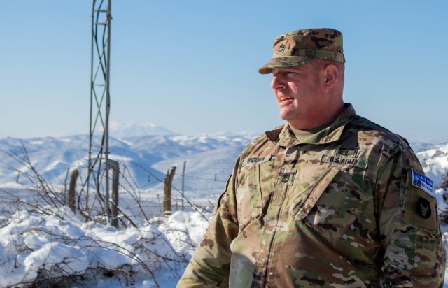 Sgt. 1st Class Rod Widows, a signal support systems specialist assigned to Kosovo Force, Regional Command-East, explains the intricacies of tower signals during a radio systems inspection at Mount Golesh in Kosovo on Jan. 28, 2021. Widows...