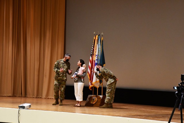 From left to right: Brig. Gen. David S. Doyle, Joint Readiness Training Center and Fort Polk commanding general, shows his appreciation to Jessica Holm, a volunteer, for her contributions to the Fort Polk community as Command Sgt. Maj. Michael C....