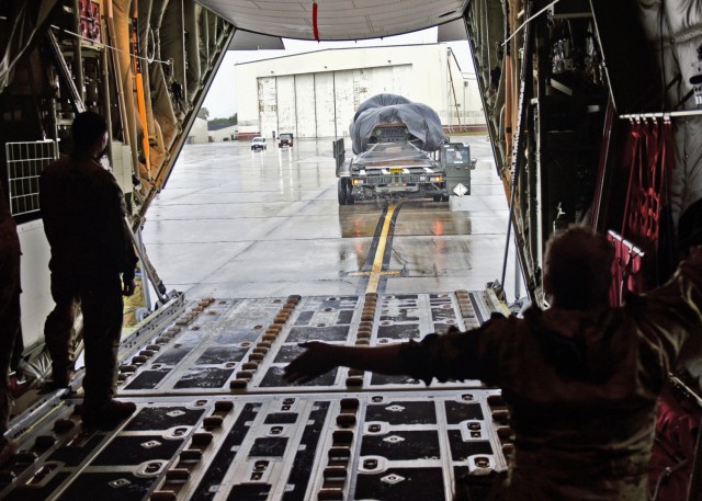 U.S. Air Force personnel load heavy drop pallets onto a C-130 aircraft at Joint Base Charleston, S.C., January 31, 2021. (U.S. Air Force Photo)  