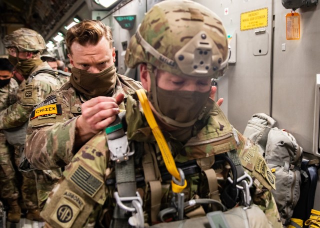 A Jumpmaster assigned to 3rd Brigade Combat Team, 82nd Airborne Division performs a Jumpmaster Personnel Inspection on a Paratrooper at Joint Base Charleston, S.C., February 1, 2021.