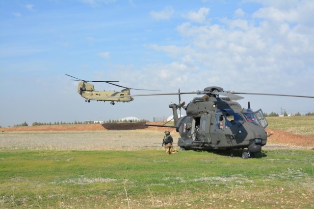U.S. Soldiers with Task Force Gambler and Italian soldiers with Airmobile Task Group Griffon respond to a downed aircraft scenario during an aerial reaction force exercise. The exercise ensured the coalition partners’ cohesiveness in responding...