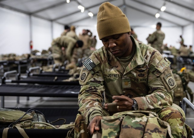 Maj. Garvis Joyner, the 3rd Brigade Combat Team, 82nd Airborne Division aviation operations officer, prepares his rucksack for a jump into the Joint Readiness Training Center at the Life Support Area on Joint Base Charleston, S.C., February 1, 2021.
