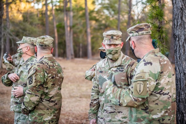 FORT BENNING, Ga. – Command Sgts. Maj. Todd Sims and T.J. Holland, the senior enlisted Soldier for Forces Command and 18th Airborne Corps, respectively, visited Sand Hill, the home of Infantry one-station unit training, to see the First 100 Yards, Jan. 29, 2021. (U.S. Army photo by Patrick A. Albright, Fort Benning Maneuver Center of Excellence photographer)

