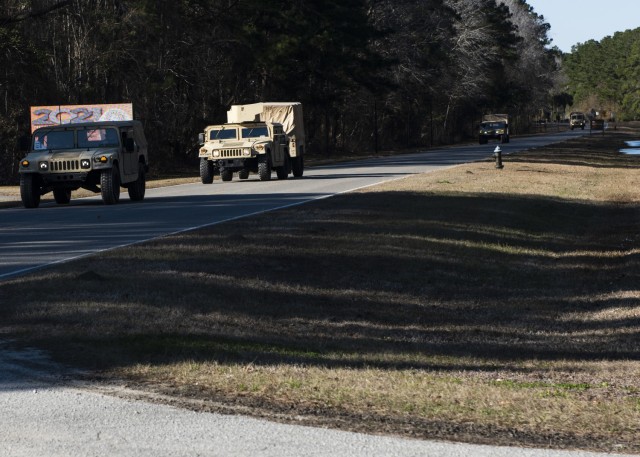 A convoy of vehicles from 1st Battalion, 508th Parachute Infantry Regiment, 3rd Brigade Combat Team, 82nd Airborne Division moves through Joint Base Charleston, S.C. during a Deployment Readiness Exercise, January 31, 2021. (U.S. Air Force Photo) 