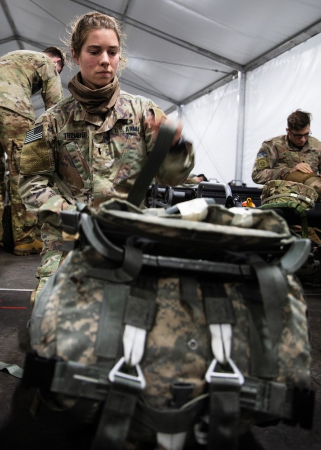 1st Lt. Susanna Trombley, a nurse assigned to Charlie Medical Company, 82nd Brigade Support Battalion, 3rd Brigade Combat Team, 82nd Airborne Division, prepares her rucksack for the jump into the Joint Readiness Training Center at the Life Support Area on Joint Base Charleston, S.C., February 1, 2021.