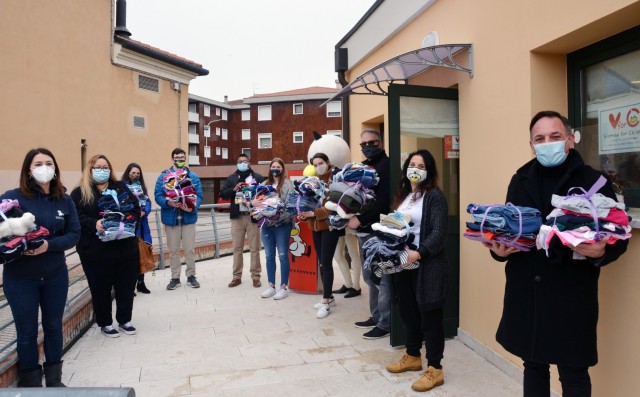 VICENZA, Italy - American students enrolled in the Child and Youth Services Keystone Club donate clothes to Vicenza for Children, (VfC) a non-profit organization the garrison is partnered with in the town of Marola Jan. 27, 2021. The gently used clothes for children, four to 14 years old, were collected during a drive to honor Martin Luther King Jr.’s Day of Service as part of the youth program.
In the picture, representatives of the CYS Keystone Club pose for a picture with members of VfC, and Matteo Tosetto, Vicenza’s city councilman for social services, family, integration policies and voluntary associations. During the donation ceremony, participants talked about future engagement with VfC considering this as the first of other projects.