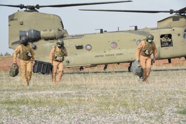 U.S. Soldiers with Task Force Gambler and Italian soldiers with Airmobile Task Group Griffon respond to a downed aircraft scenario during an aerial reaction force exercise. The exercise ensured the coalition partners’ cohesiveness in responding...