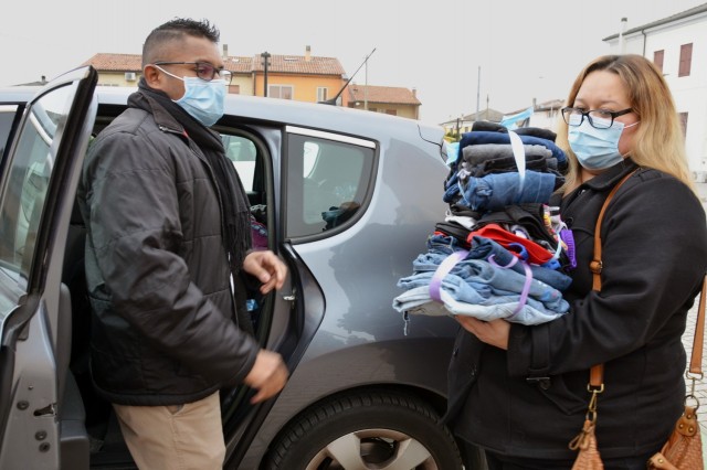 VICENZA, Italy - Davisen Poorcelan, Child and Youth Services youth program director (left) and Danielle Campos, CYS youth program Keystone advisor prepare to bring the clothing donation to Vicenza for Children, a non-profit organization the garrison is partnered with in the town of Marola Jan. 27, 2021.
