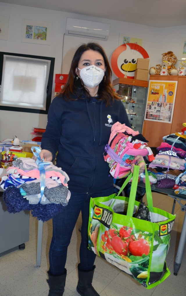 VICENZA, Italy - Silvia Antonello, Vicenza for Children member shows some of the items after the Child and Youth Services Keystone Club clothing donation taken to the non-profit organization in the town of Marola Jan. 27, 2021. The gently used...