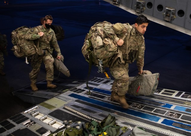 Paratroopers assigned to 3rd Brigade Combat Team, 82nd Airborne Division load a U.S. Air Force C-17 Globemaster III at Joint Base Charleston, S.C., February 1, 2021. The C-17 would fly them to Fort Polk, Louisiana where they would parachute into their Joint Readiness Training Center rotation.