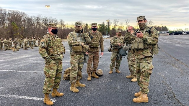 Lt. Col. Tom Warth, right, officer in charge of the Kansas National Guard contingent sent to the U.S. Capital region, prepares his team for the day Jan. 19. More than 250 Kansas National Guard Soldiers and Airmen travelled to D.C. Jan. 17 to...