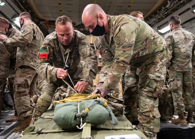 Jumpmasters assigned to 1st and 3rd Brigade Combat Teams, 82nd Airborne Division prepare a door bundle for air drop at Joint Base Charleston, S.C., February 1, 2021.